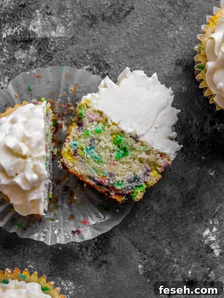 Classic Funfetti Cupcakes with Vanilla Frosting 11 frosted funfetti cupcake split in half (1)