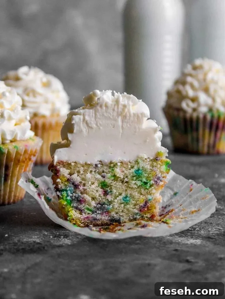 Classic Funfetti Cupcakes with Vanilla Frosting 6 frosted funfetti cupcake split in half (2)