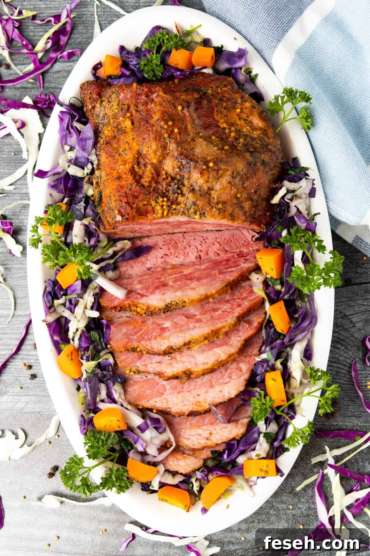 Smoked Corned Beef Recipe for Tender, Flavorful Brisket 2 Corned beef on white platter with cabbage and carrots