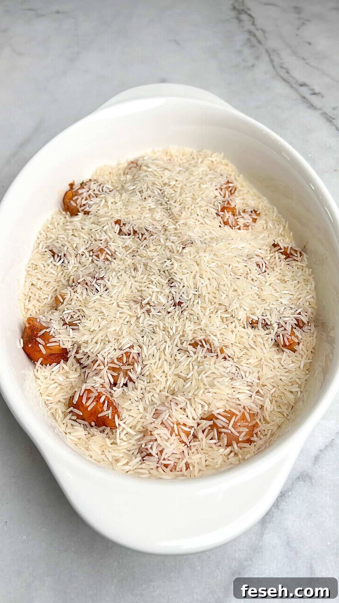 Greek-Style Chicken Tzatziki Casserole 8 rice added to the casserole dish