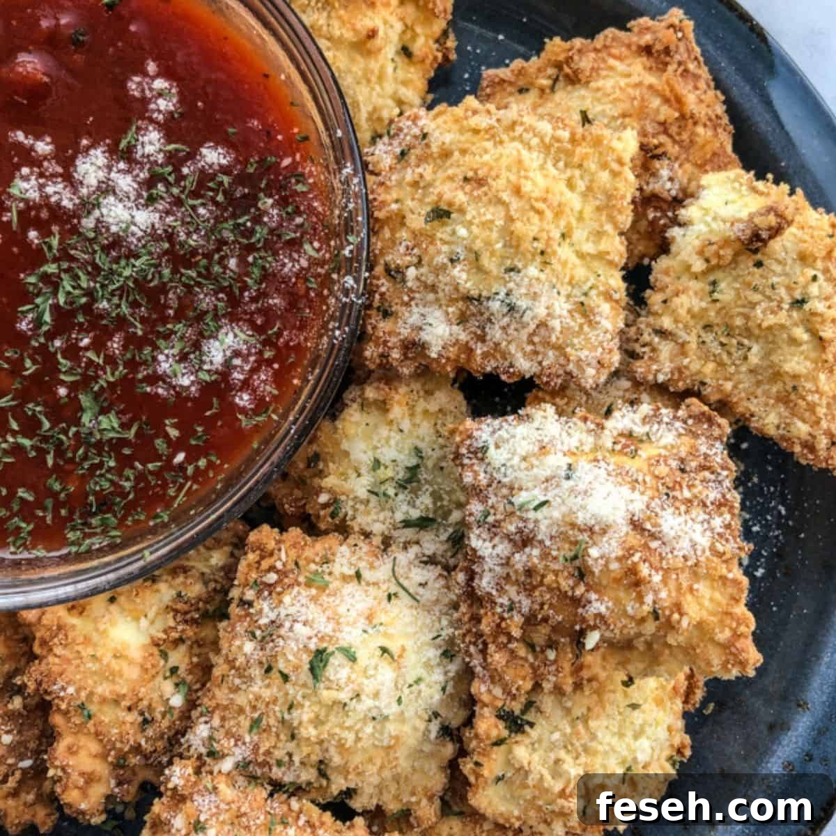 Crispy Toasted Ravioli in the Air Fryer 2 Crunchy toasted ravioli is a simple Italian appetizer that is breaded with parmesan cheese and breadcrumbs