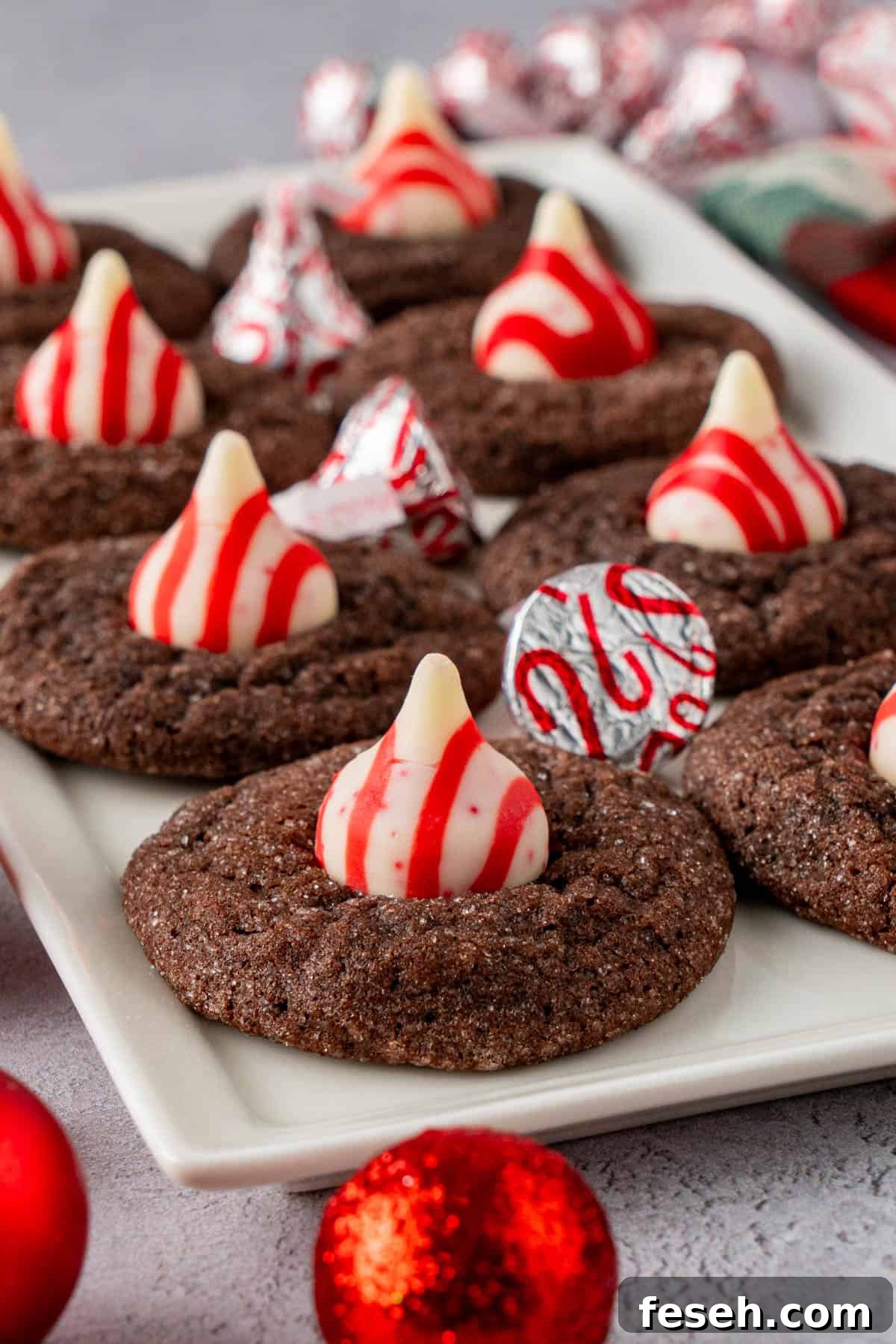 Chocolate Kiss Cookies with Hershey Candy Cane Kisses 7 close up shot of Chocolate Kiss Cookies With Hershey's Candy Cane Kisses