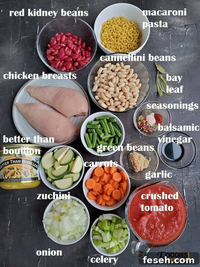 Hearty Chicken Minestrone Soup with Vegetables 3 recipe ingredients on black surface