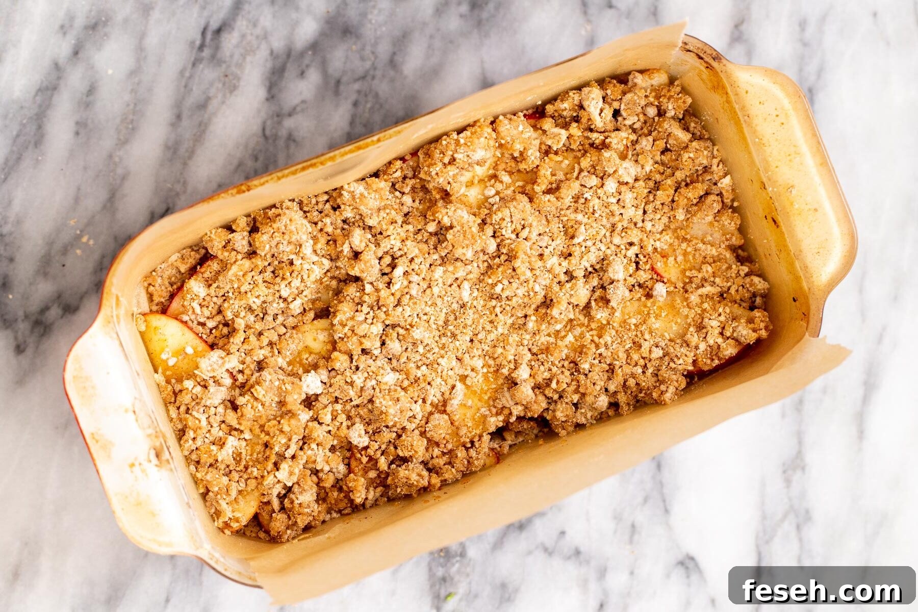 Vegan Apple Pie Bars with Cinnamon Streusel 8 apple pie crumble bars in a baking pan