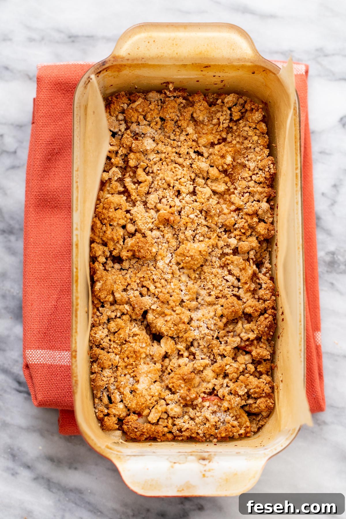 Vegan Apple Pie Bars with Cinnamon Streusel 9 freshly baked vegan apple pie bars on a marble countertop