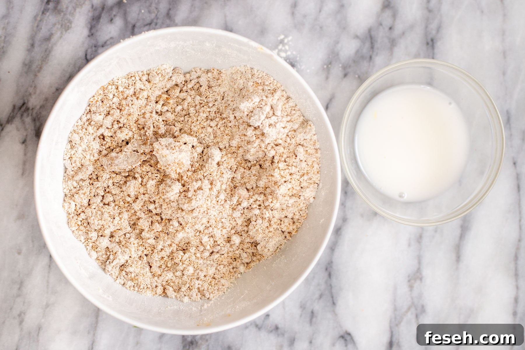 Vegan Apple Pie Bars with Cinnamon Streusel 5 crust ingredients being combined in a white bowl