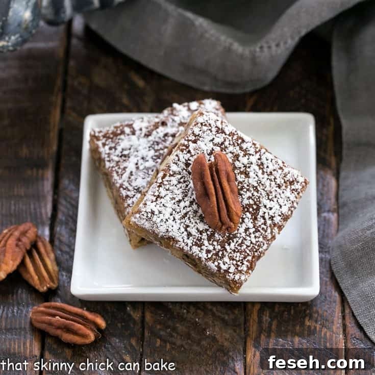 2 pecan bars on a small square plate