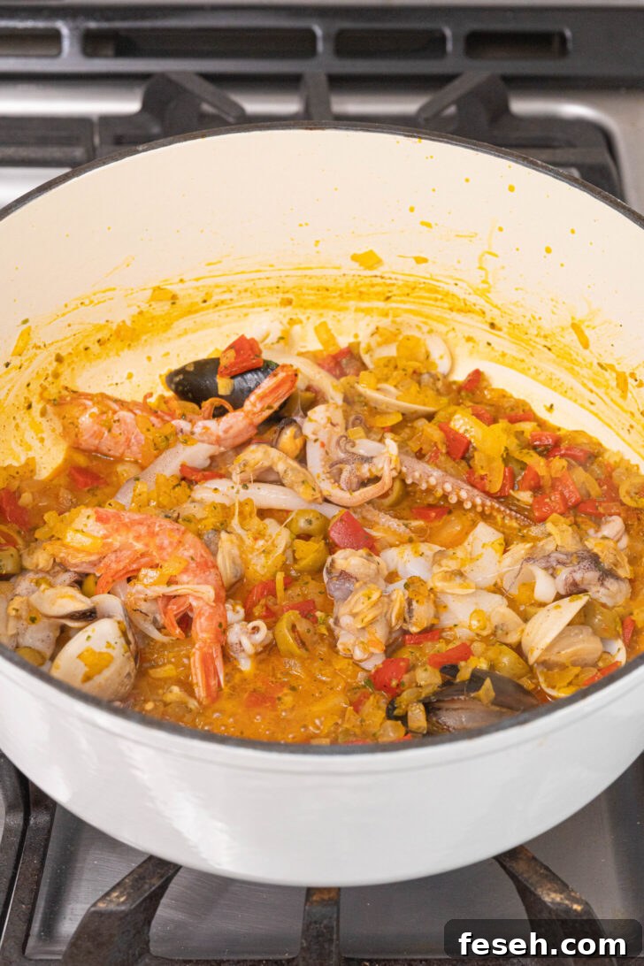 Puerto Rican Arroz con Mariscos Recipe - Authentic Seafood Rice 6 A pot of seafood rice cooking.