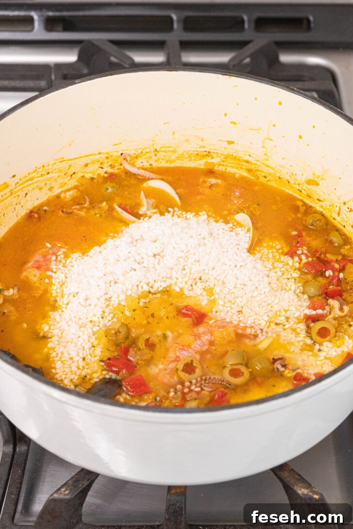 Puerto Rican Arroz con Mariscos Recipe - Authentic Seafood Rice 7 A pot of seafood rice cooking.
