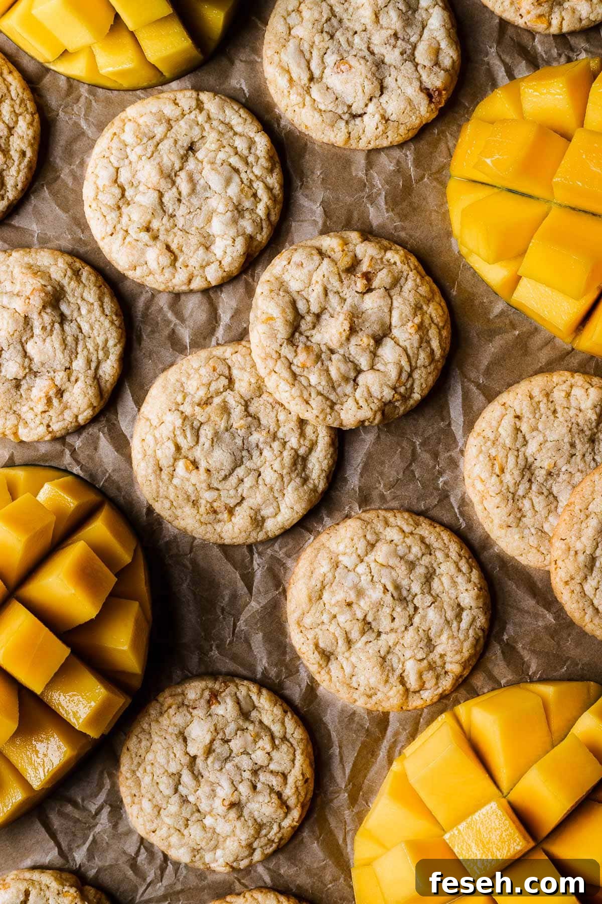 Tropical Mango Cookies with Coconut Glaze 2 Cookies with sliced mangos peeking into the image.