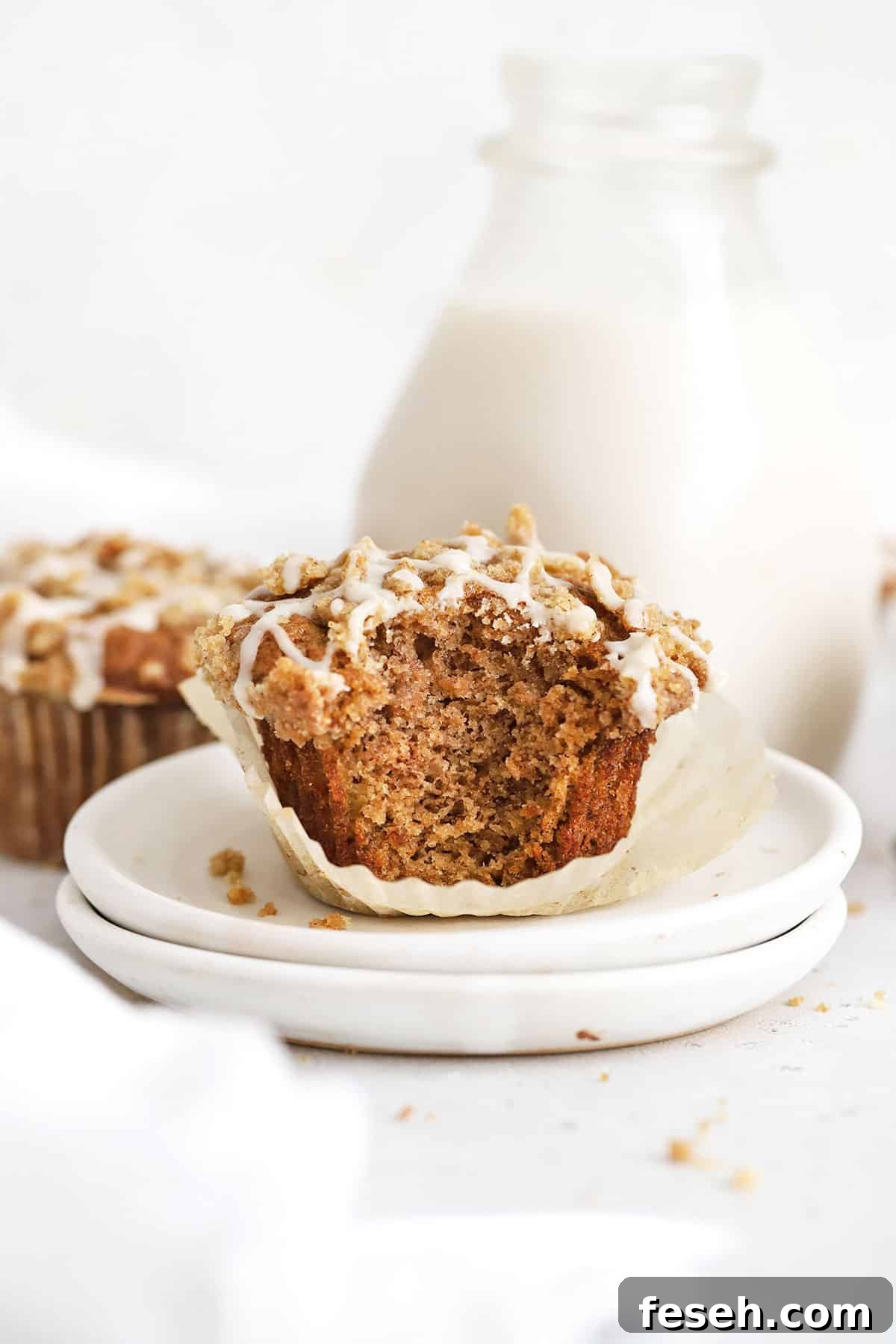 Gluten-Free Banana Crumb Muffins with Cinnamon Streusel 6 Gluten-Free cinnamon muffins on white plates