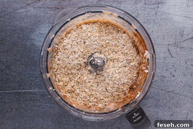 No Added Sugar Blueberry Pie Bars Recipe 7 Oats and applesauce in a food processor.
