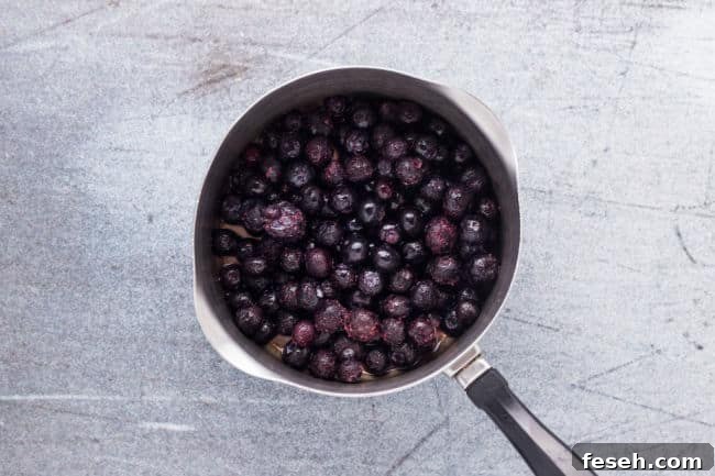 No Added Sugar Blueberry Pie Bars Recipe 9 Blueberries in a small pan.
